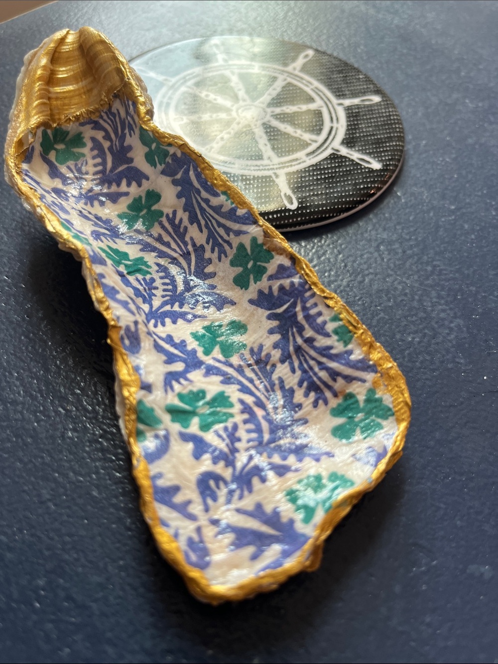 Decoupaged oyster shell/trinket dish.